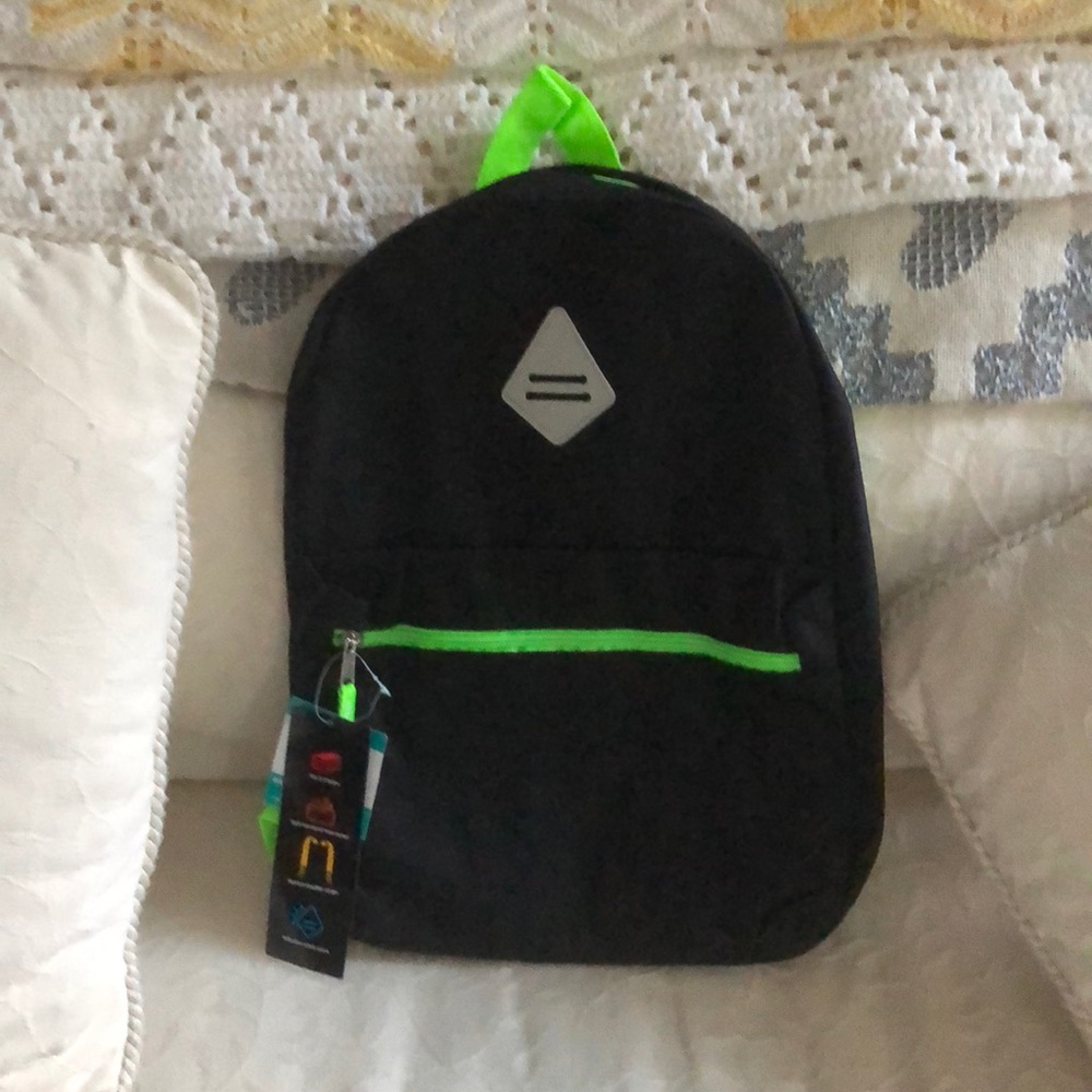 Black backpack with lime green zipper and straps.